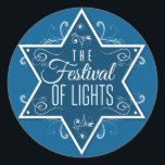 Sticker Rond Star of David Festival of Lights Blue Hanoukka<br><div class="desc">Une grande étoile bleu cobalt de David est la pièce centrale de cette impression autocollante contre un arrière - plan bleu plus clair. Les mots "Le Festival des Lumières" s'impriment à l'intérieur de l'étoile avec des tourbillons à l'intérieur et rayonnant à l'extérieur de l'étoile pour faire une belle faveur Hanoukka....</div>