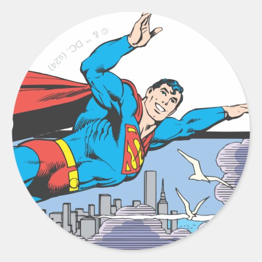 Sticker Rond Superman Flies Thru City (Devant)