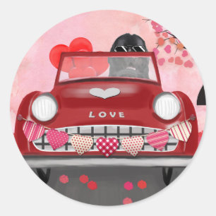Sticker Rond Terre-Neuve dans une voiture avec des coeurs