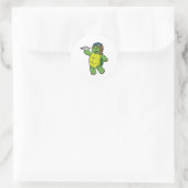 Sticker Rond Tortue comme pilote avec avion en papier (Sac)