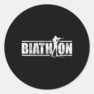 Sticker Rond Un biathlète avec fusil et skis de fond Moti