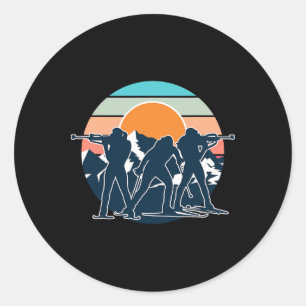 Sticker Rond Un biathlète avec fusil et skis de fond Moti