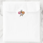 Sticker Rond Un boulanger kitty brandissant ses beignets (Sac)