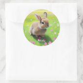 Sticker Rond Un mignon lapin dans une prairie fleurie (Sac)