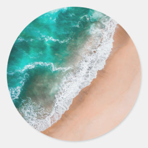 Sticker Rond Vagues sur la plage de sable