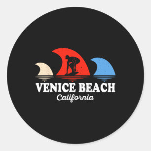 Sticker Rond Venise rétro sur la plage de Californie faisant du