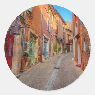 Sticker Rond Ville colorée sur une colline française