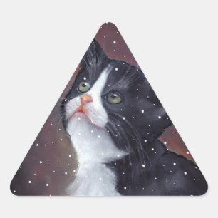 Sticker Triangulaire Chat de smoking regardant des flocons de neige,