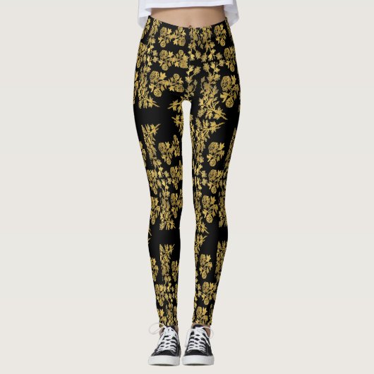 Stijlvolle gouden bloemenprint op zwart leggings (Voorkant)