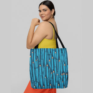Strak ingepakte blauw gekleurde potloden met goude draagtas
