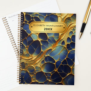 Stralende organische gouden lijnen op blauwe indig planner