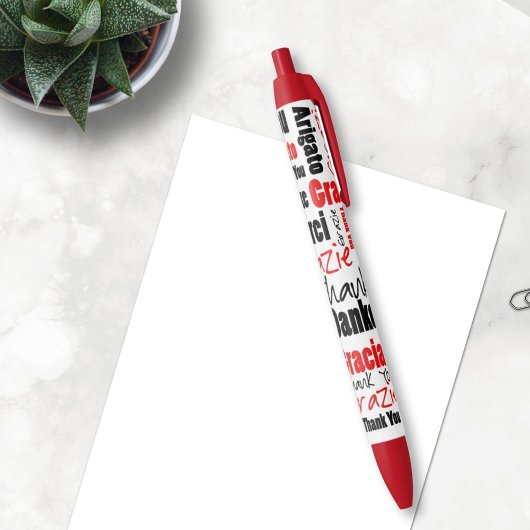 Stylo Noir Merci multilingue noir rouge typographie