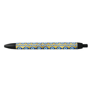 Stylo Noir motif de l'oeil malin sur la texture dorée