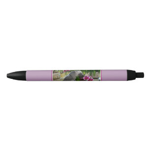 Stylo Noir Perroquet de gris africain avec des orchidées