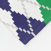 Sur la couverture en polaire Jacquard vert (Coin)