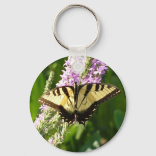 Swallowtail Butterfly op Paarse wilde bloemen Sleutelhanger