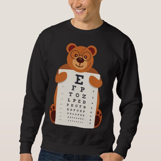Sweatshirt and Cute Teddy Bear with Glasses holding an Eye Ch (Devant)