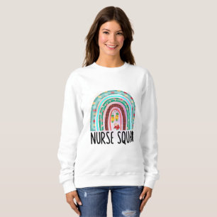 Sweatshirt Escadron de soins infirmiers de Noël Arc-en-ciel