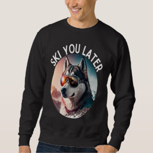 Sweatshirt Husky vibrant portant des lunettes de ski sur les 