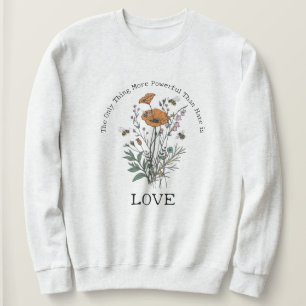 Sweatshirt La seule chose plus puissante que la haine est l'a