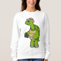 Tortue photographe avec caméra