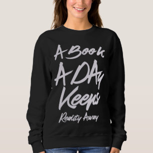 Sweatshirt Un livre par jour éloigne la réalité du livre