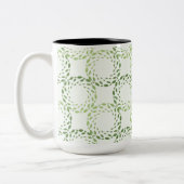 Swirling green leaf pattern tweekleurige koffiemok (Links)