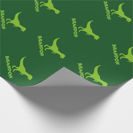 T-rex dinosaurusverpakkingspapier en kinder aangep cadeaupapier (Hoek)