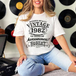 T-shirt Anniversaire Vintage Personnalisé À La Perfection<br><div class="desc">Célébrez les anniversaires jalons avec style et humour dans notre T-Shirt d'Anniversaire Vintage personnalisé. Conçu pour les fêtes d'anniversaire au whisky, cette chemise présente un look vintage classique qui résonne avec un charme intemporel. Que vous fassiez un 30ème, un 40ème, un 50ème ou une année spéciale, le motif "Aged to...</div>