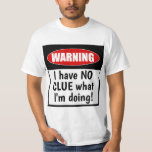 T-shirt Attention. Je n'ai AUCUNE CLUE sur ce que je fais<br><div class="desc">Ce T-Shirt drôle dit : Attention : JE N'AI AUCUNE IDÉE de ce que je fais ! Nous avons tous l'impression d'être parfois au-dessus de nos têtes, alors pourquoi ne pas fêter ça avec un peu d'humour. Ce drôle de t-shirt fera rire où que vous le portiez. Un grand cadeau...</div>