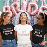 T-shirt Bachelorette Party Most Likely To Get Married<br><div class="desc">Bring a touch of playful anticipation to the bachelorette festivities with this charming and customizable t-shirt design! Featuring the perfectly fitting phrase "most likely to GET MARRIED" in delicate pink lettering against a crisp white background, this design is both sweet and sassy. It's an ideal choice for the bride-to-be or...</div>