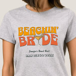 T-shirt Beach Bachelorette Party Retro Beachin Bride<br><div class="desc">Faites un peu de plaisir à votre prochaine soirée de bachelorette avec ce magnifique jeu de maillots de plage personnalisés. Que vous fêtiez un voyage à la plage, des vacances pour les filles ou des vacances pour les meilleurs amis, ces t-shirts personnalisés pour les fêtes de bachelorette de plage sont...</div>