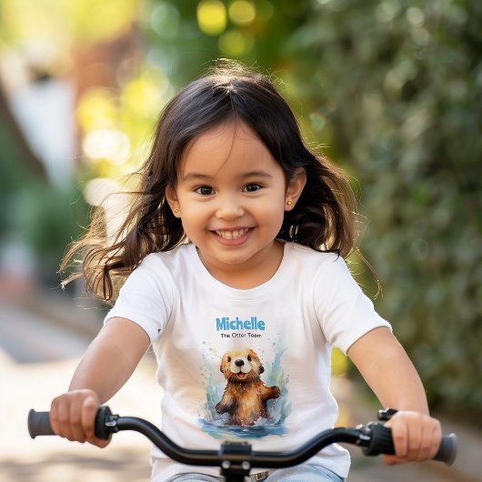 T-Shirt Bébé mignon loupe de mer dans des éclaboussures d'
