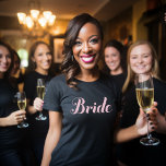 T-shirt Bride Mariage noir de script rose clair<br><div class="desc">Tee - shirt noir simple et chic avec design "mariée" en écriture rose clair. Fait un grand cadeau mariage !</div>