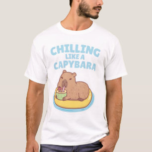 T-shirt Capybara Sur Un Flotteur De Piscine Se Chalissant