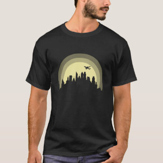 T-shirt Ciel avec avion bâtiment silhouette de ville garço