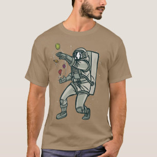 T-shirt Design spatial cool avec un astronaute jongle