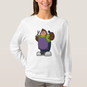 T-shirt Gorilla comme coiffeur avec ciseaux et peigne