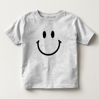 T-shirt heureux d'enfant en bas âge de visage