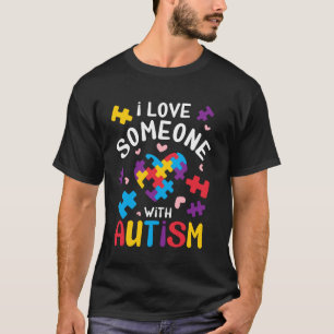 T-shirt J'aime quelqu'un avec le puzzle de coeur d'autisme