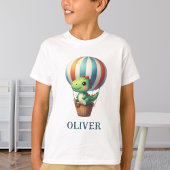 T-shirt Le Dino Vert mignon prend l'avion dans un ballon à