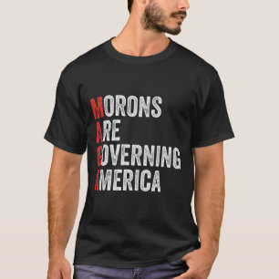 T-shirt Les Morons dirigent l'Amérique contre Trump