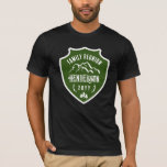 T-shirt Montagnes Rustiques Pine Green Shield Réunion fami<br><div class="desc">T-shirt rustique retrouvailles familiales avec votre nom de famille écrit sur un bouclier vert avec retrouvailles familiales imprimé dans un texte incurvé sur les montagnes avec l'année entre les bois et les épinettes sous un design rustique. T-shirt de réunion de famille de bouclier vert personnalisé avec votre nom de famille...</div>