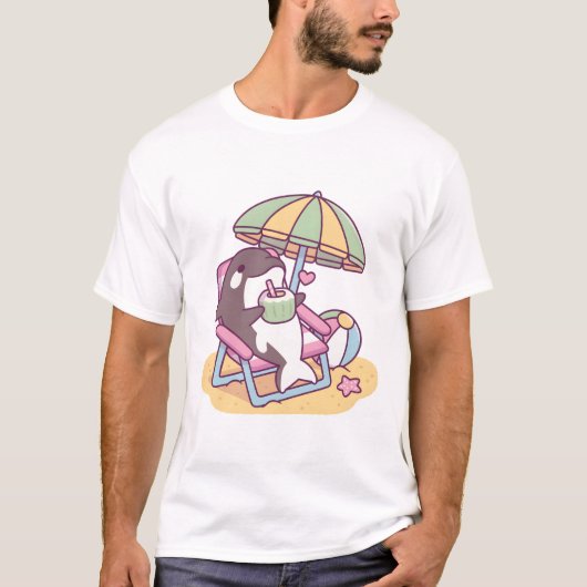 T-shirt Orque Mignon se Détendant Sous un Parasol de Plage (Devant)