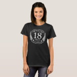 T-shirt Porcelaine traditionnelle mariage anniversaire 18<br><div class="desc">Un design pour célébrer 18 ans de mariage. Ce design a un design couleur laurier blanc (Porcelaine) sur un arrière - plan noir. La porcelaine est le cadeau traditionnel pour cette occasion. Le texte dit Porcelain 18 ans anniversaire. Un design romantique pour célébrer votre 18e année de mariage. Si vous...</div>