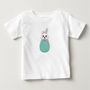 T-shirt Pour Bébé Joli lapin blanc tenant l'oeuf de Pâques