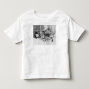 T-shirt Pour Les Tous Petits Jeune garçon habillé en cowboy avec jouets
