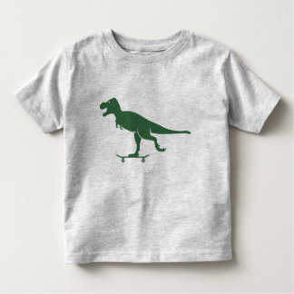 T-shirt Pour Les Tous Petits T Rex sur une chemise de planche à roulettes