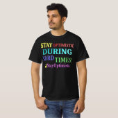 T-shirt "RESTE OPTIMISTE" Joli design. Commandez dès maint (Devant entier)