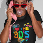 T-shirt Retro I Love Les années 80 | Quatre-vingts<br><div class="desc">T-shirt noir des années 80 amusant et coloré,  avec un texte clair de couleur néon disant "j'aime les années 80",  une cassette,  des lunettes de soleil rétro brillantes,  un blaster ghetto (boombox),  et quelques étoiles éparpillées.</div>